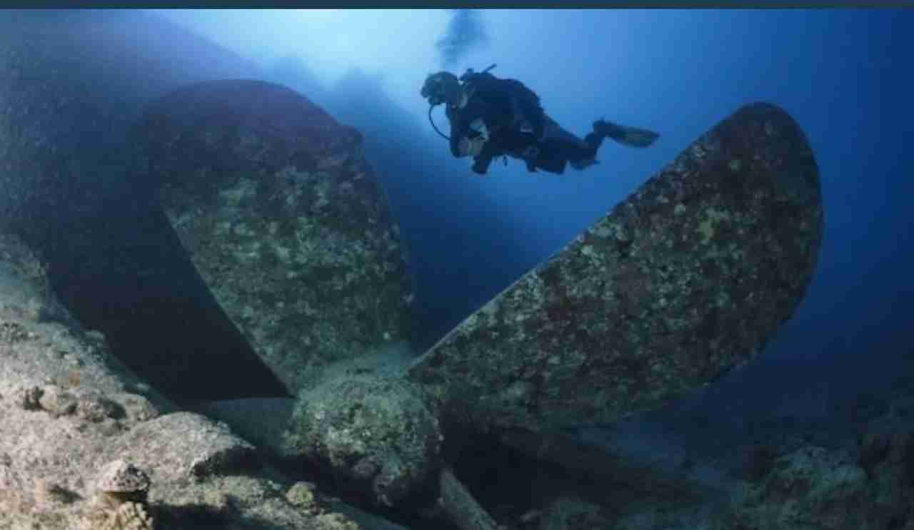 Four-bladed propeller at the stern of a deep wreck