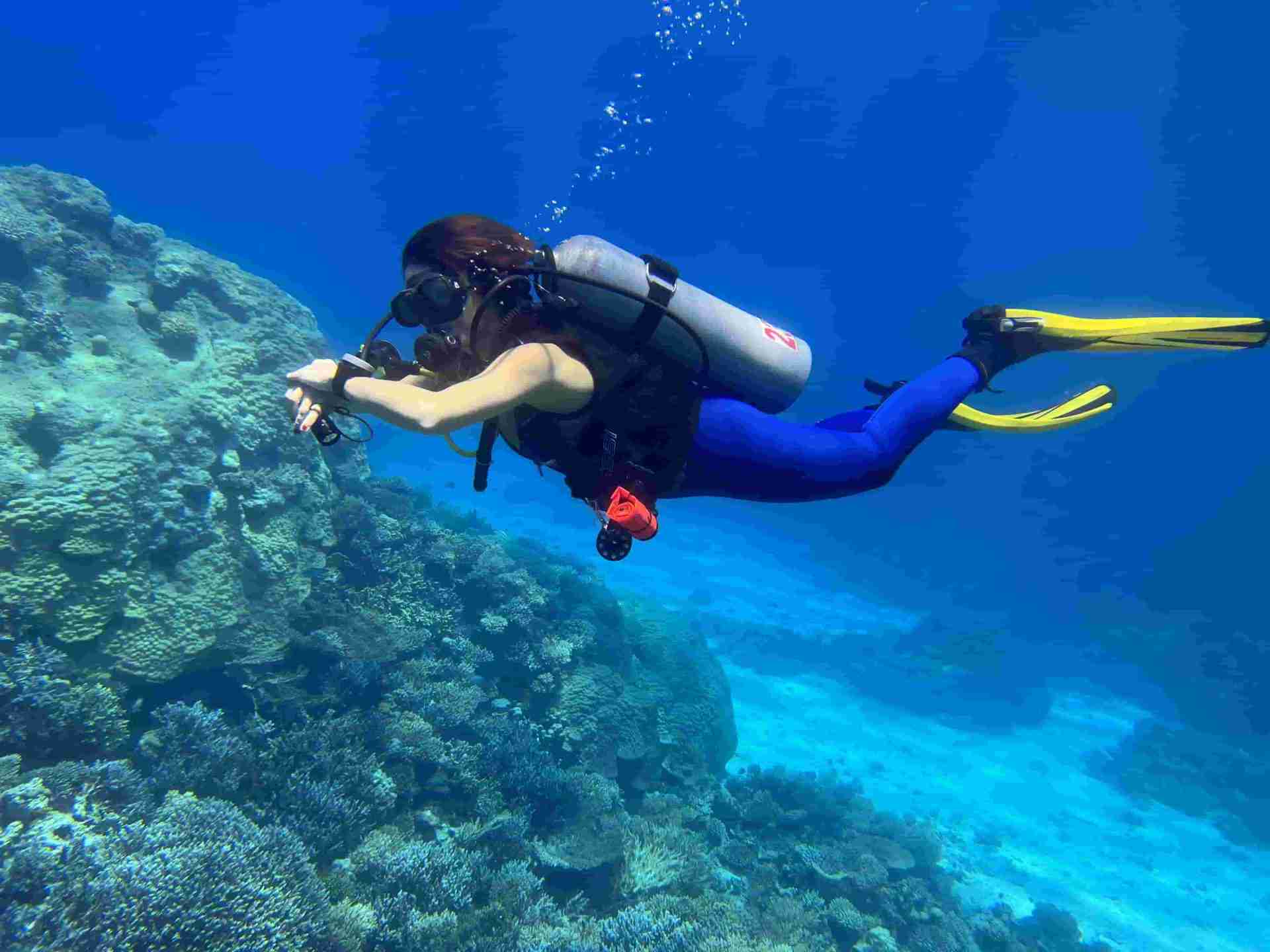 Diver over shallow coral at the Hurghada dive sites