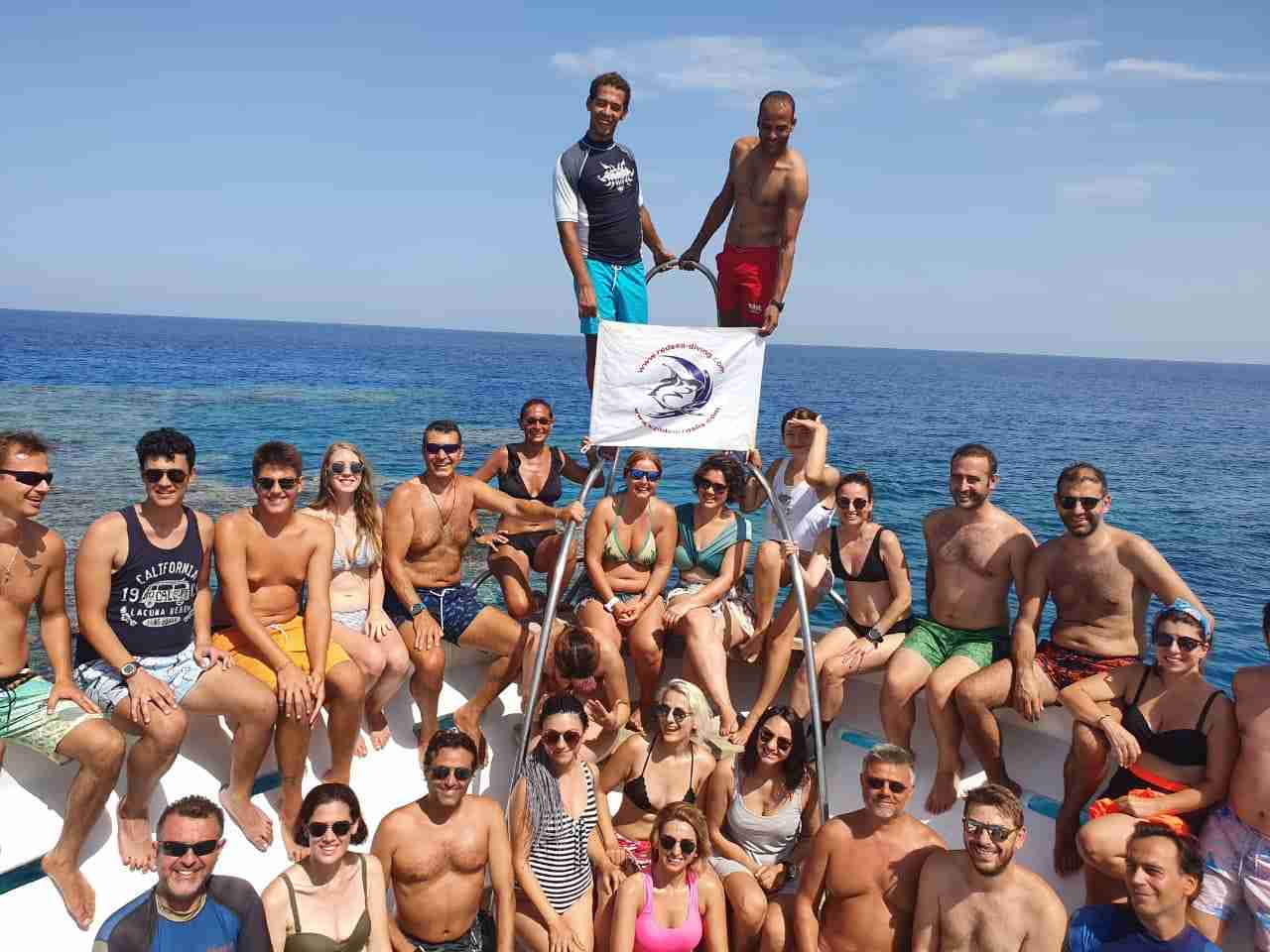 Divers on the boat heading out from the marina